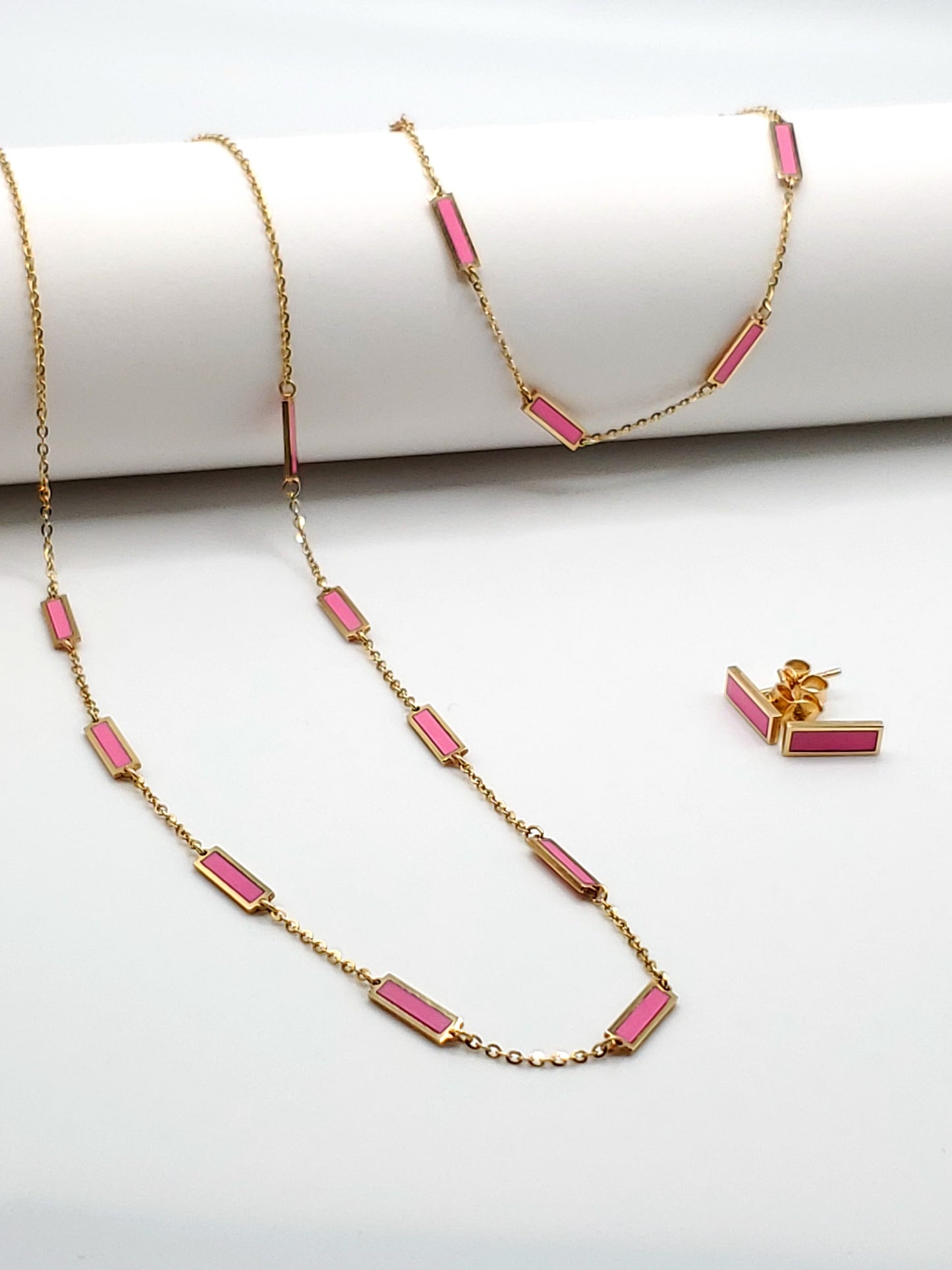 14k gold necklace, bracelet, and earrings with pink bars